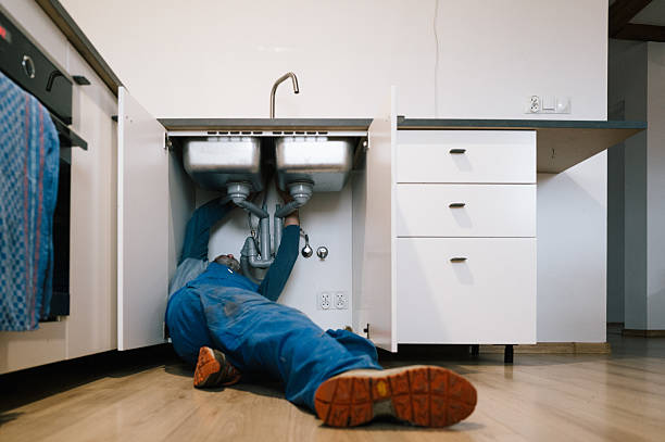 Professional Plumbing technician working in Bagley, IA